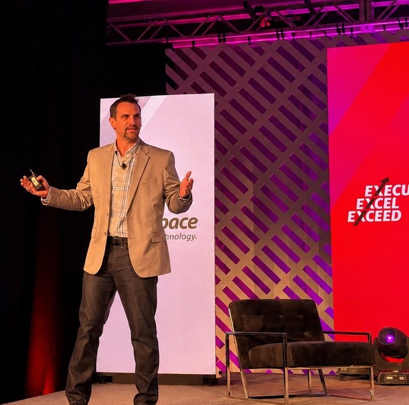 Josh Prewitt speaking at an enterprise technology conference